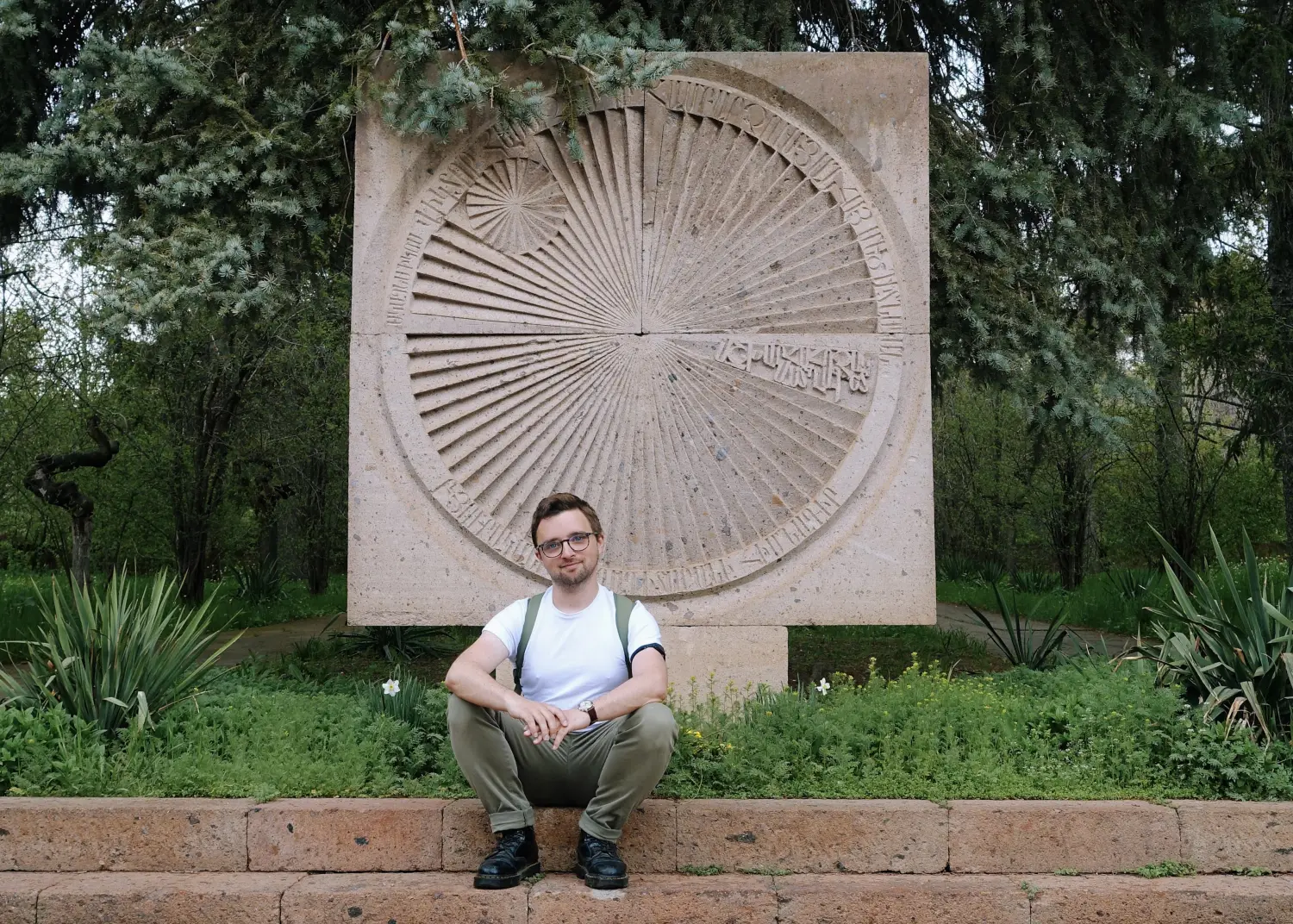 Patrick Lerner in front of an Armenian sundial carving